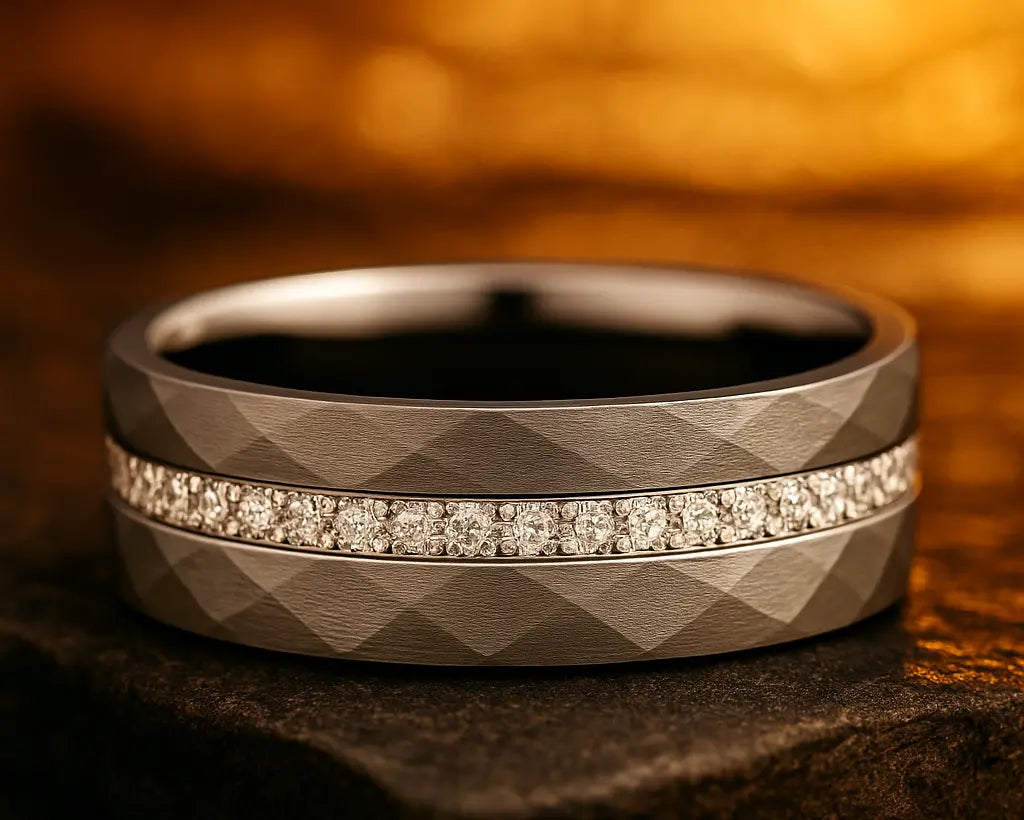 Silver diamond-studded ring with hammered design on a textured surface with a warm background
