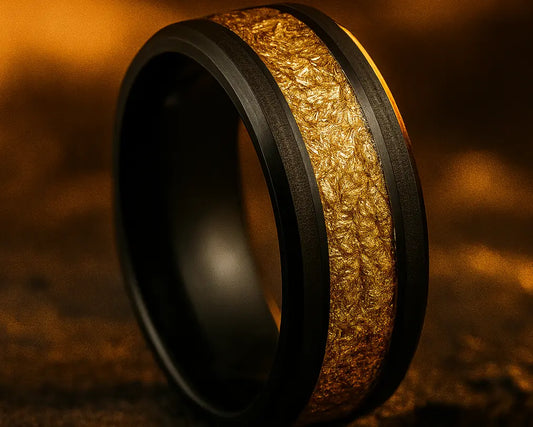 Ring with gold and black design on a textured brown background