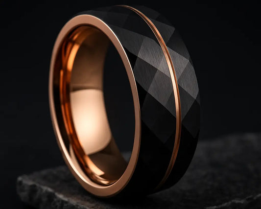 Black and rose gold ring on a dark background