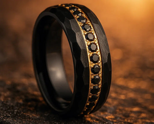 Black ring with gold accents and embedded stones on a textured brown surface
