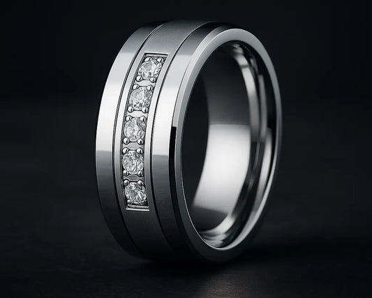 Silver ring with embedded diamonds on a black background